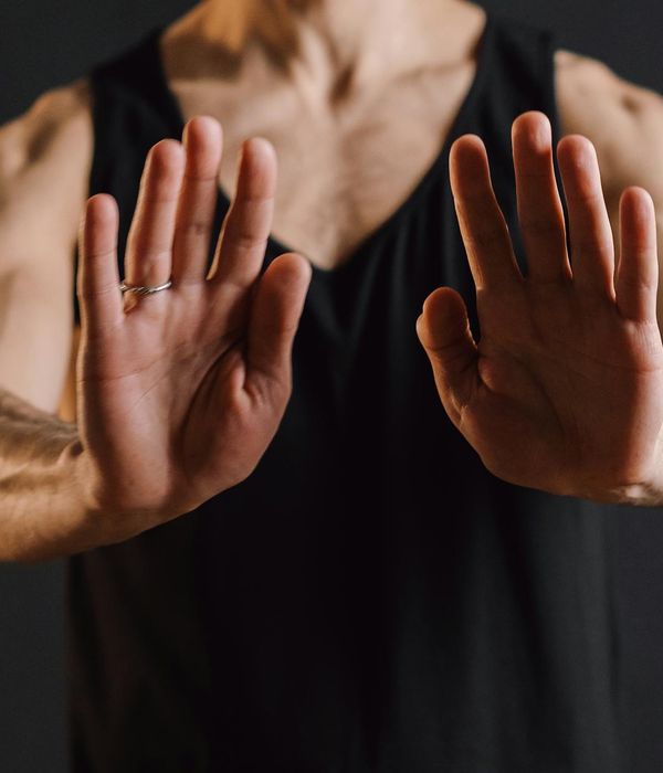 A person in deep meditation, hands in a mudra gesture, embodying tranquility.